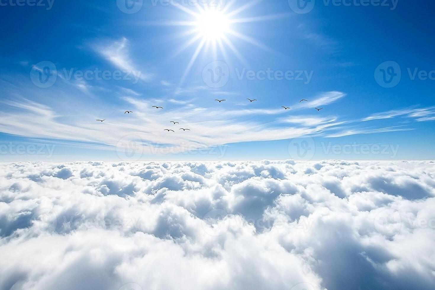 A view of the sun shining over the clouds photo