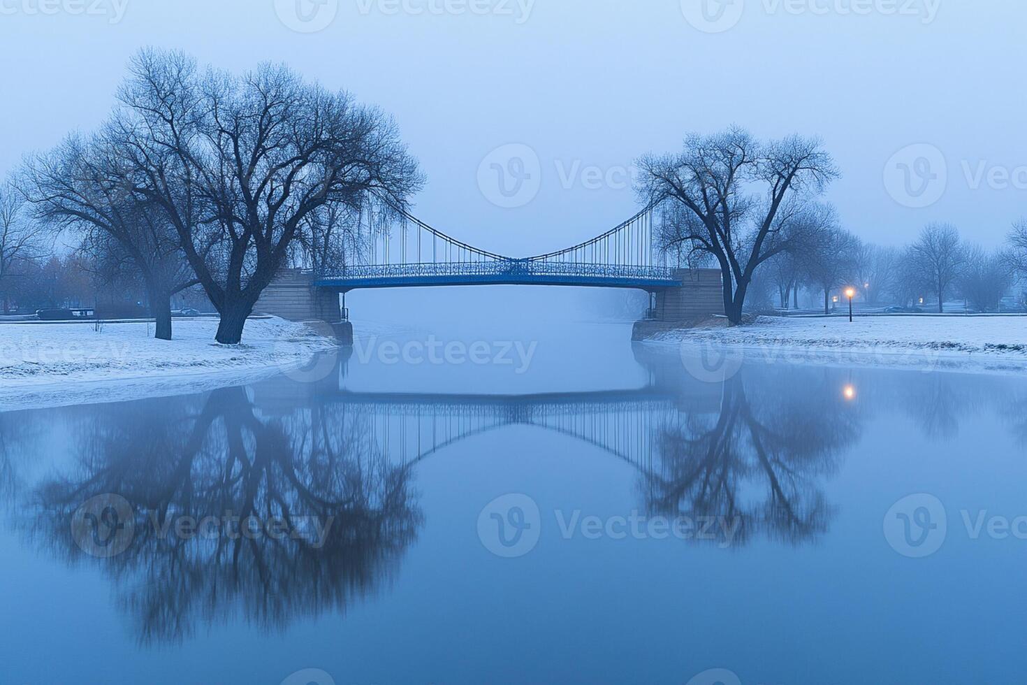 A bridge over a river in a foggy day photo