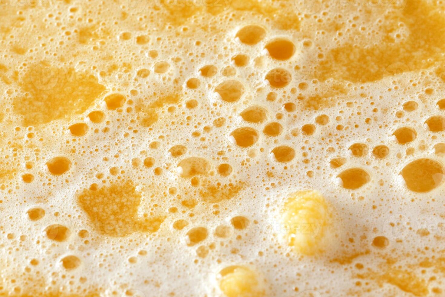 A close up of a foam of orange juice photo