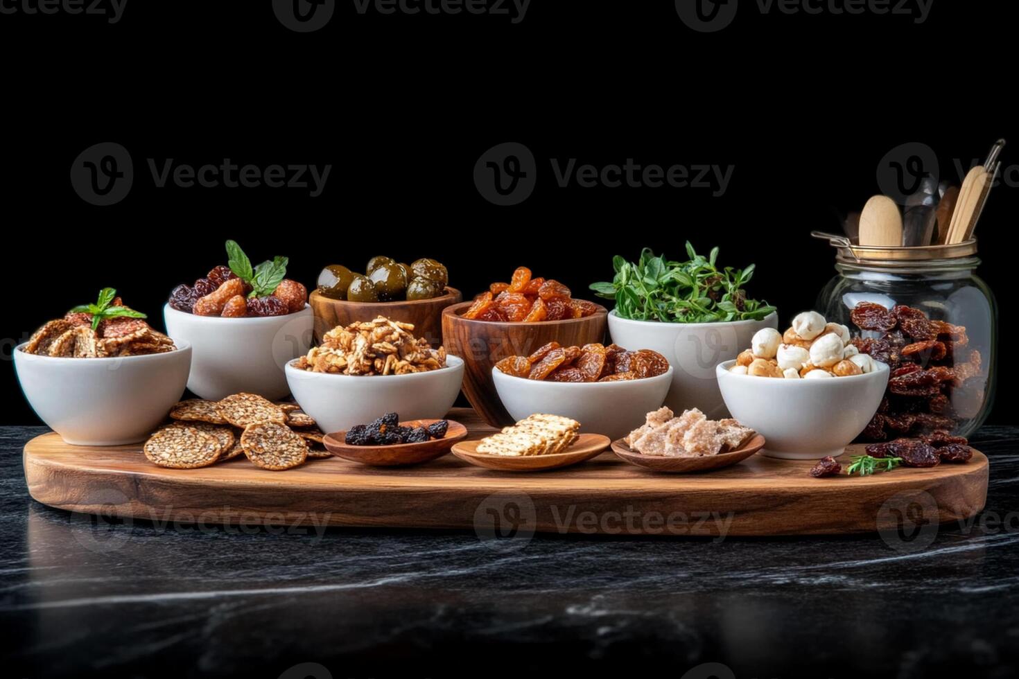 A wooden tray with different types of nuts and dried fruits photo