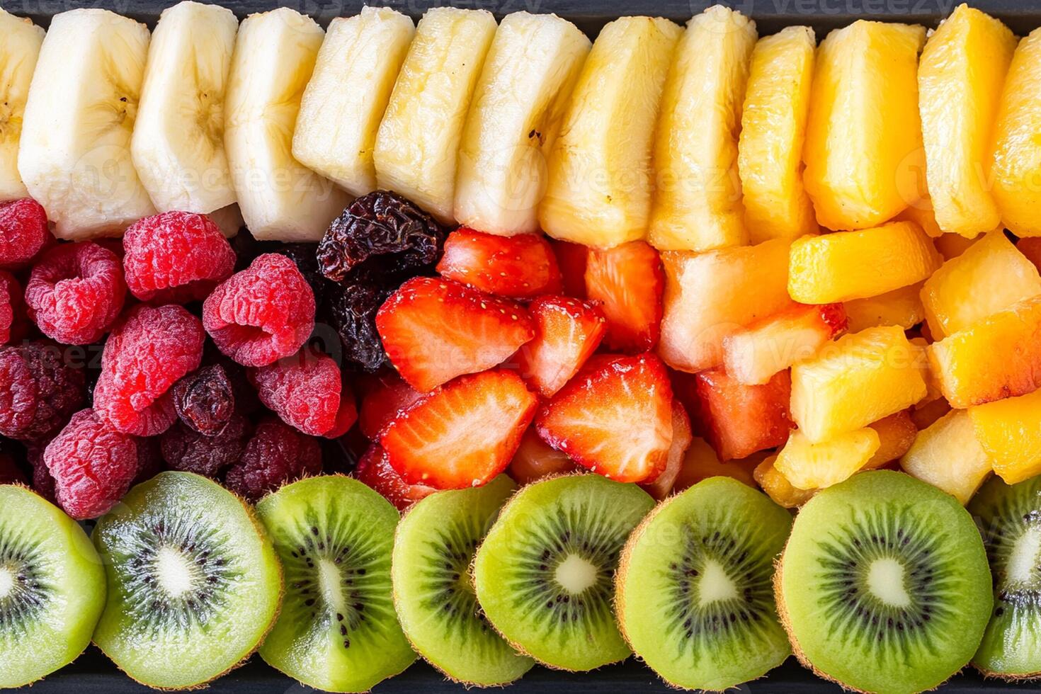 A tray of fruit arranged in a rainbow pattern photo