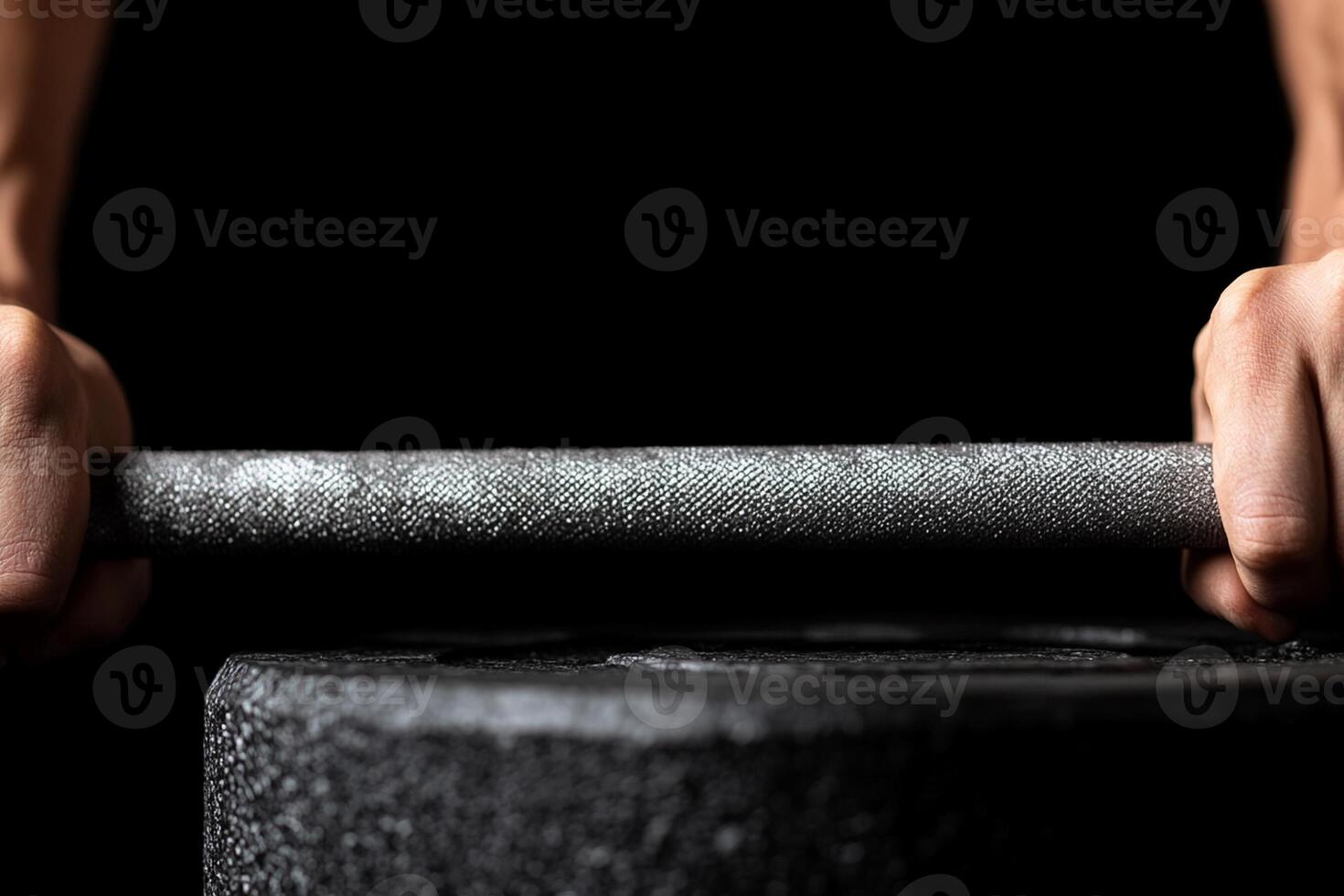 A person's hands are holding a barbell photo
