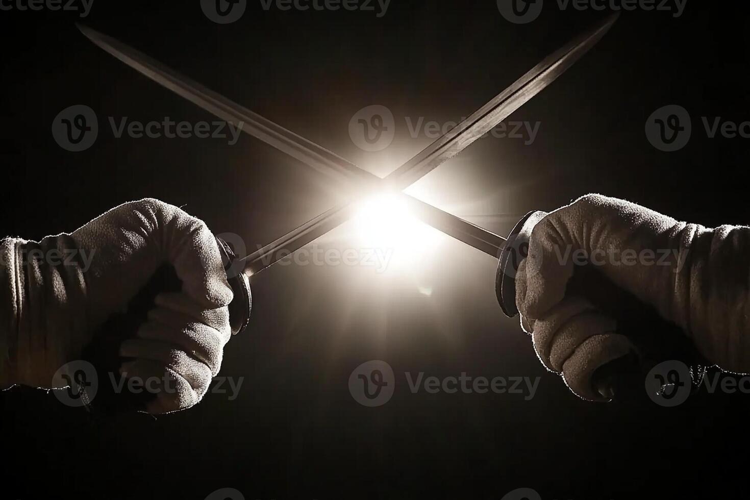 Two hands holding two swords in front of a light photo