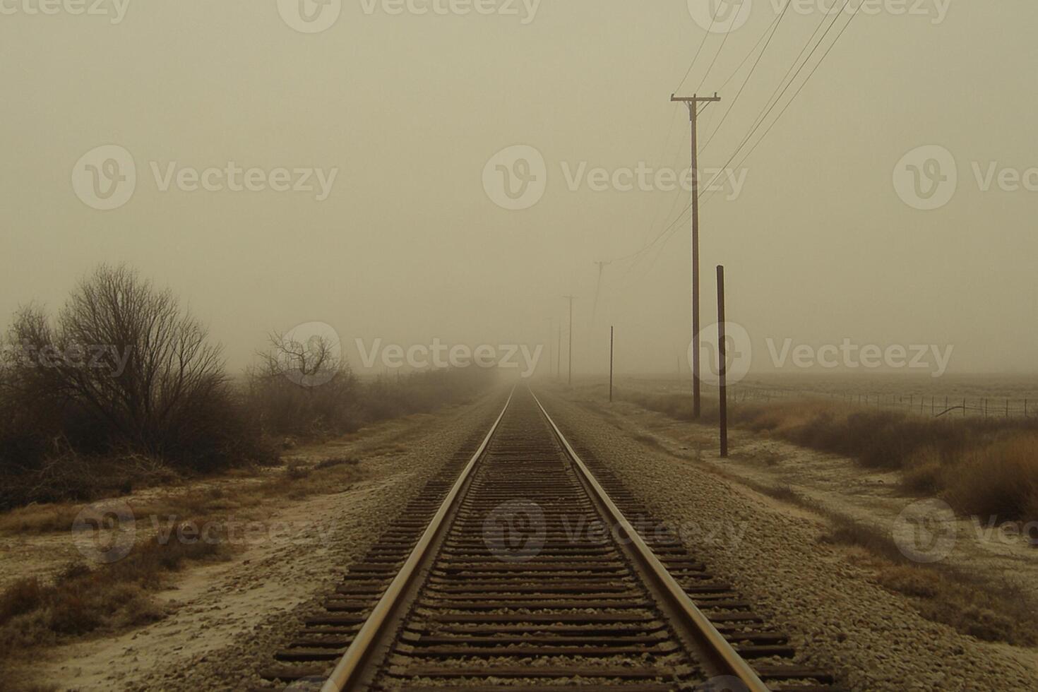A train track in the foggy countryside photo