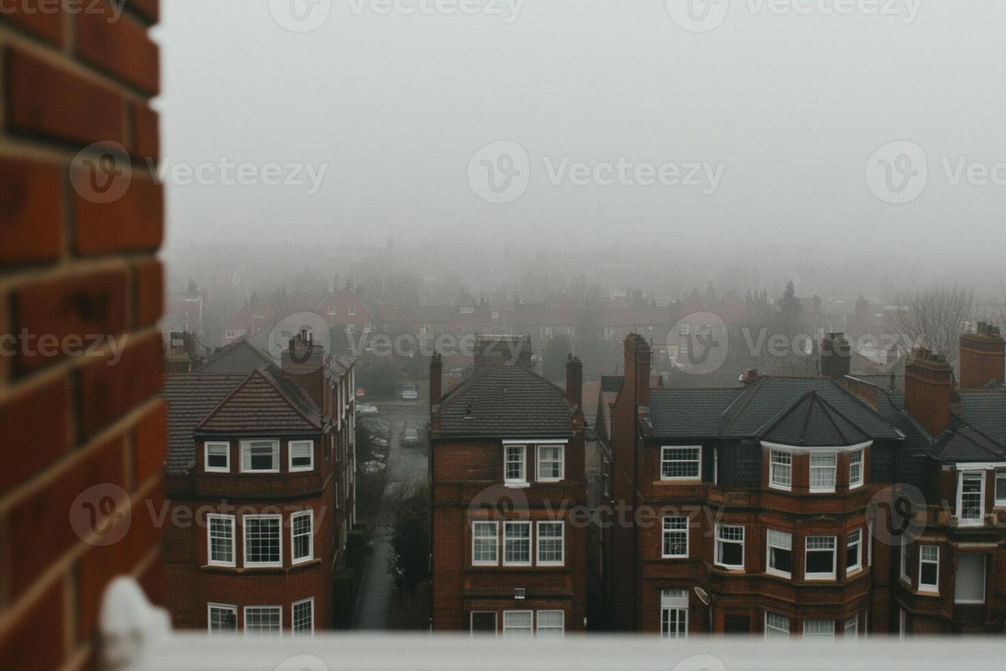 A view of a foggy city from a window photo