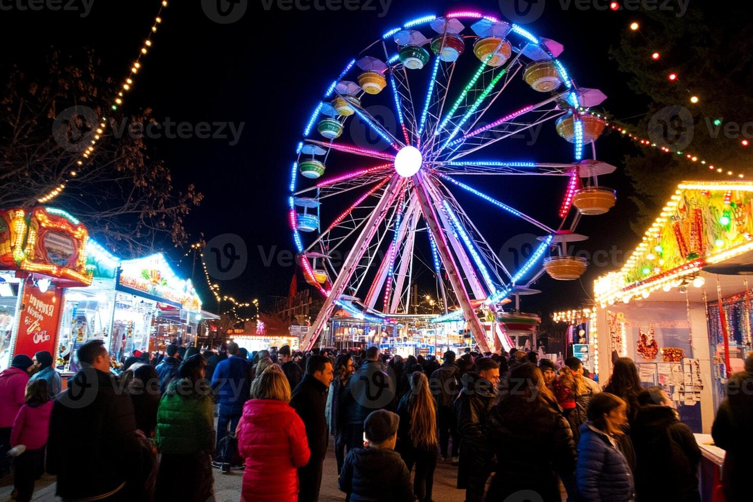 A large crowd of people at a carnival with a ferris wheel photo