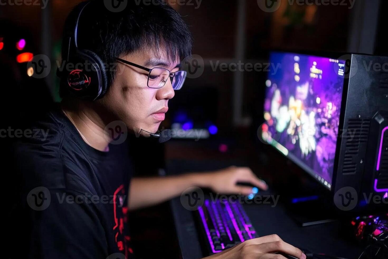 A man wearing headphones and a black shirt is playing a game photo
