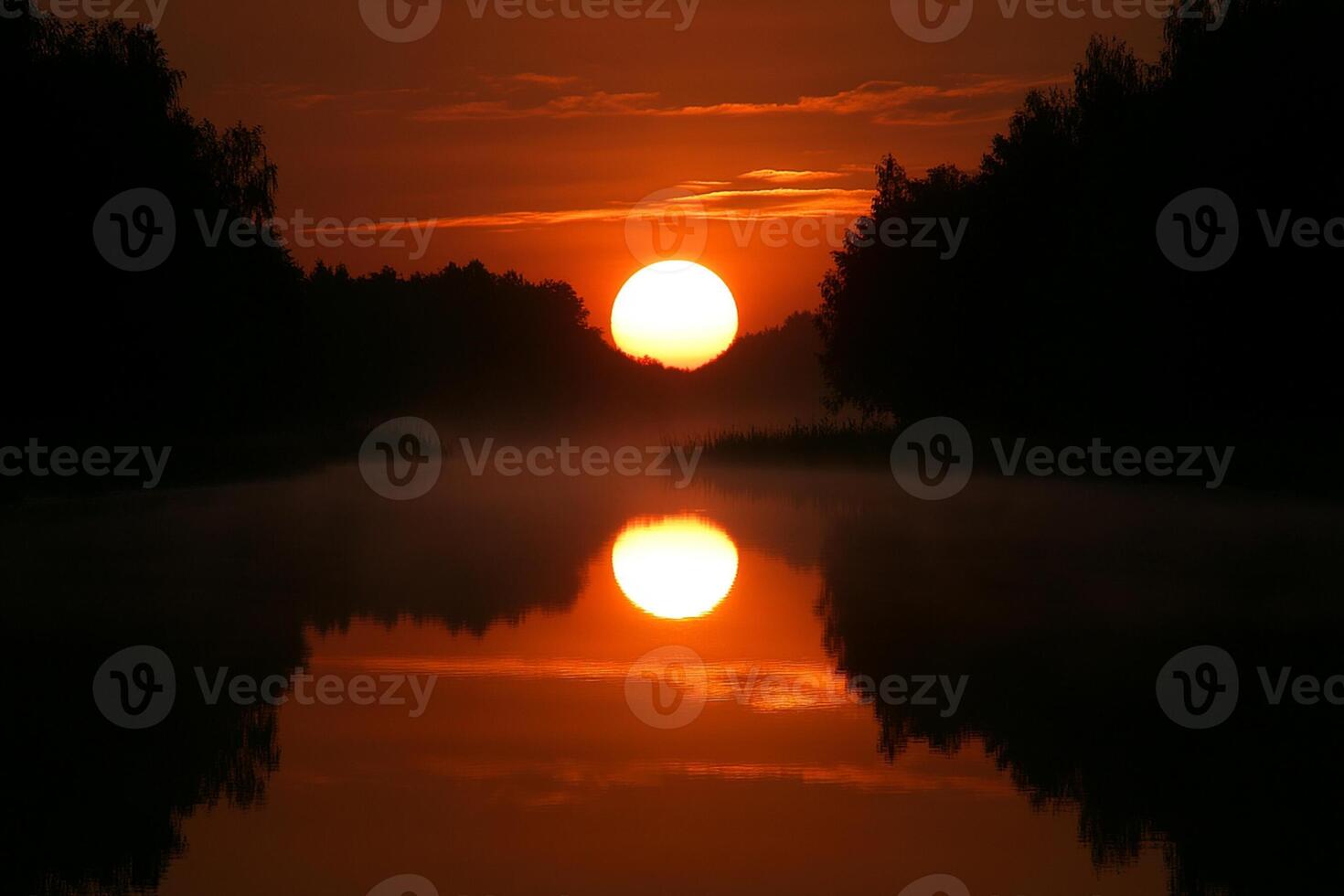 The sun is setting over a river photo