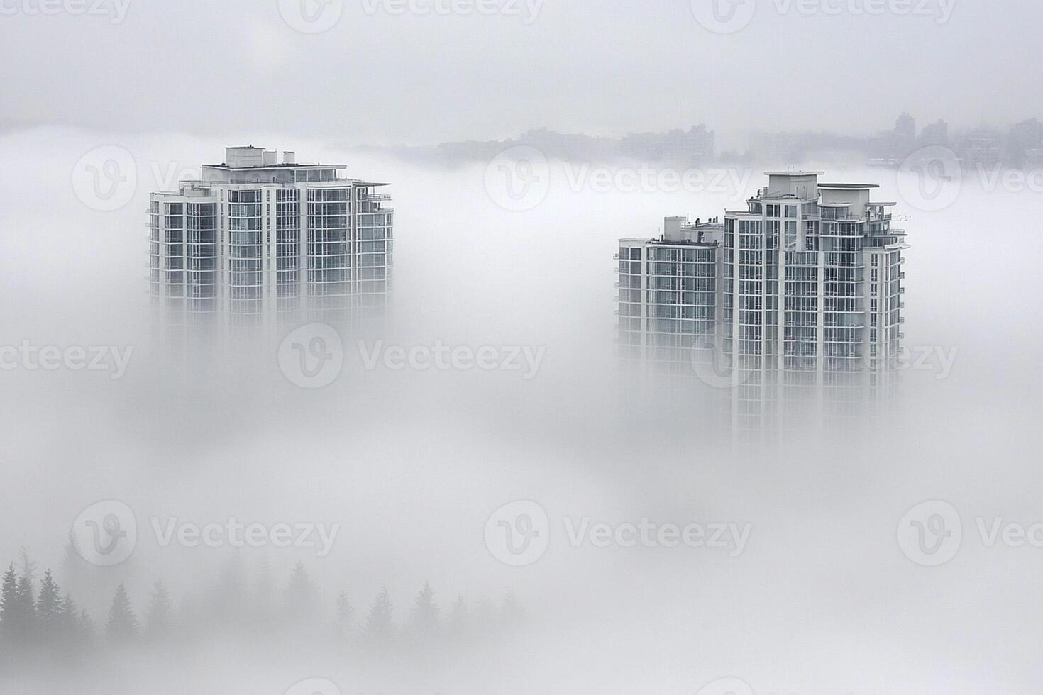 Two tall buildings in the fog photo