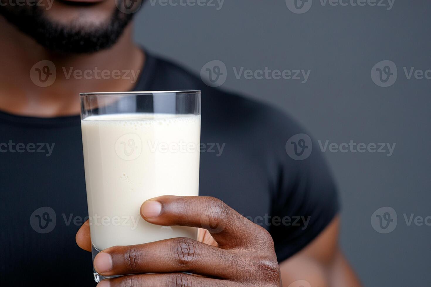 A man holding a glass of milk photo