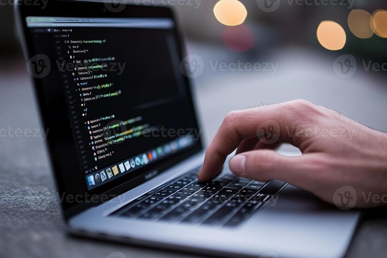 A person typing on a laptop with code on it photo