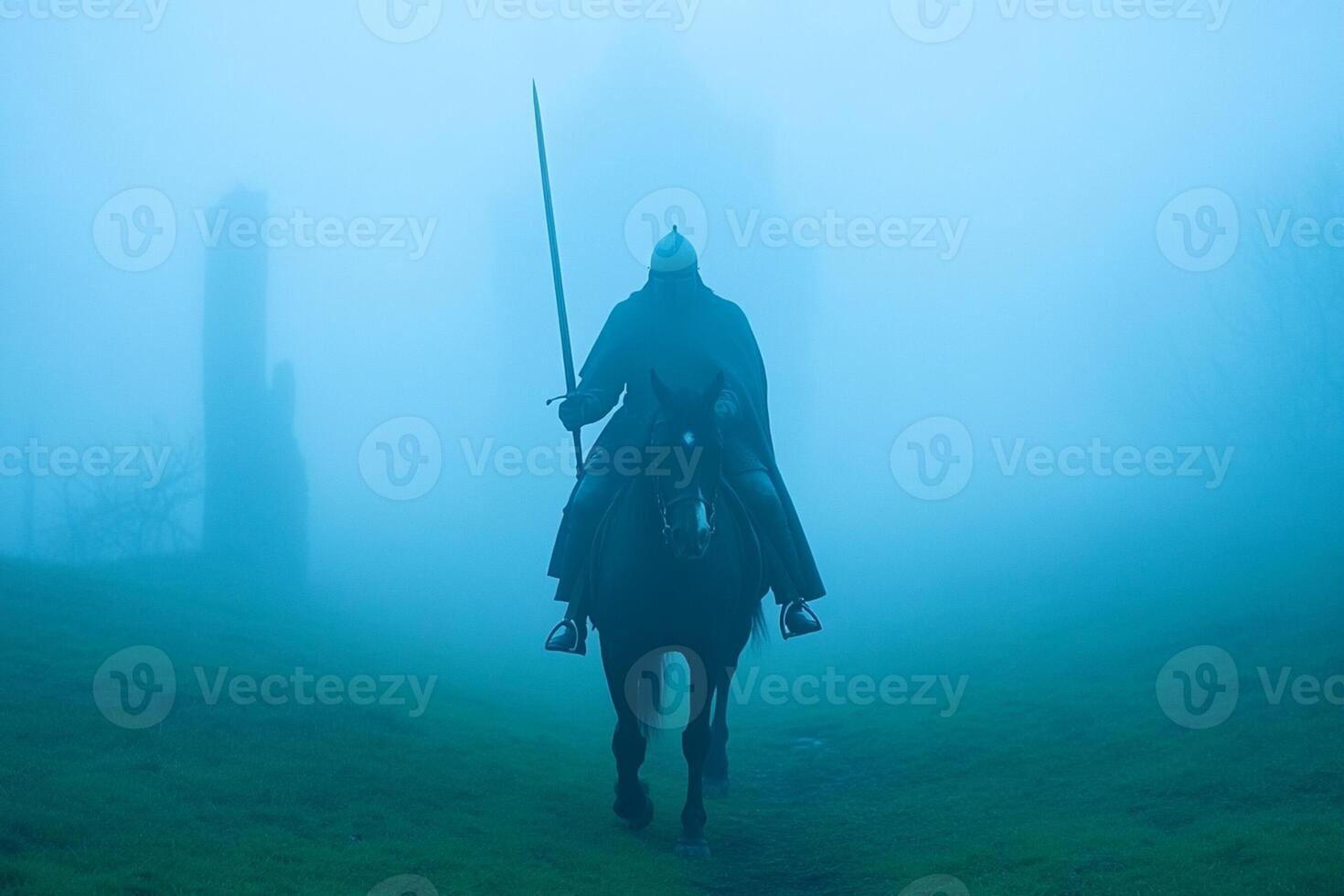 A knight on horseback in the fog photo