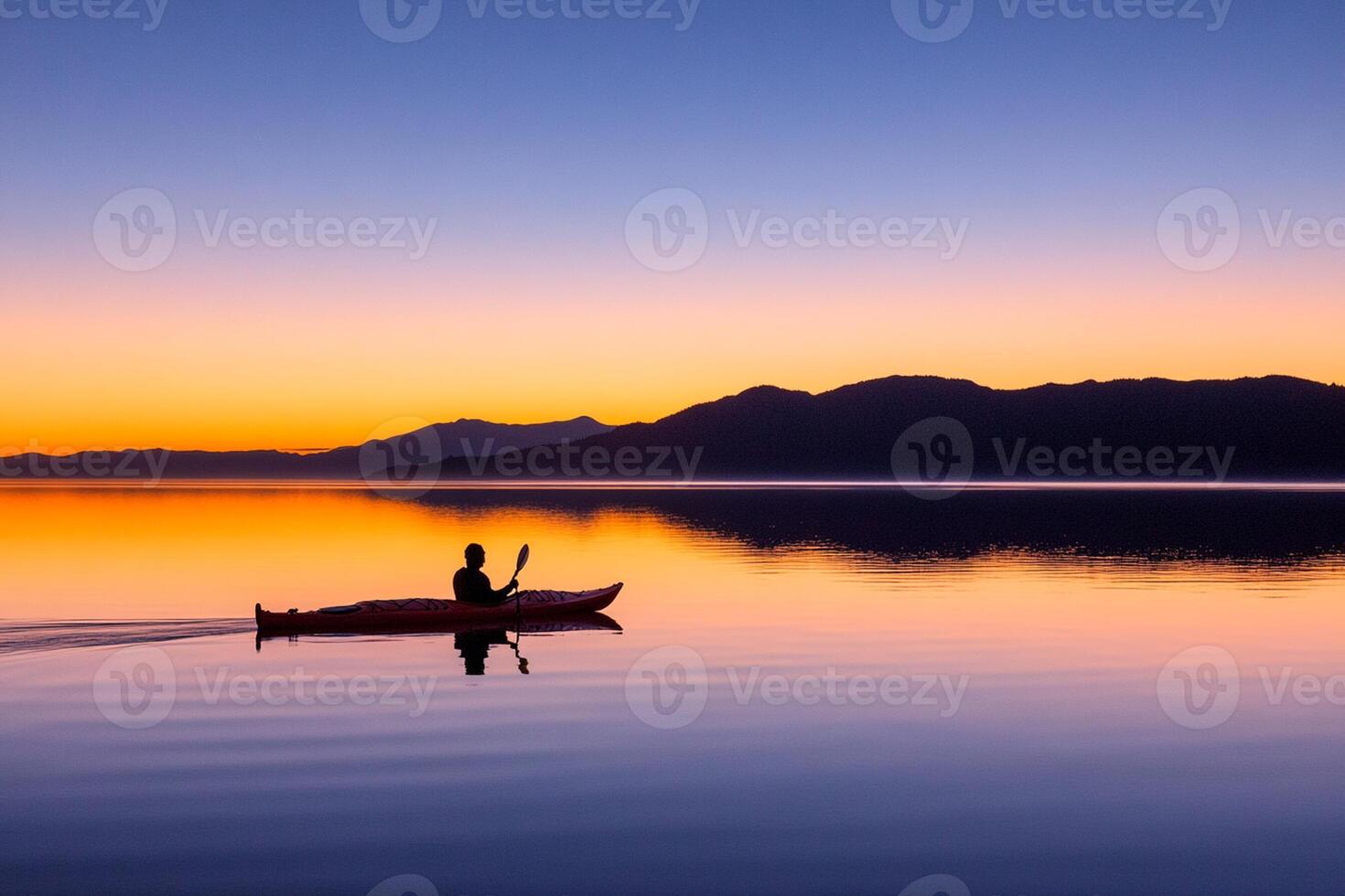 A person in a canoe at sunset photo