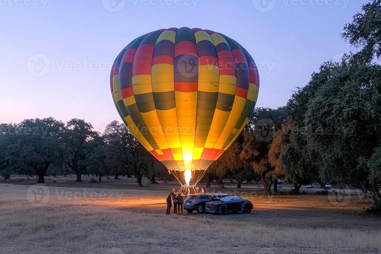A hot air balloon is being lifted into the air photo