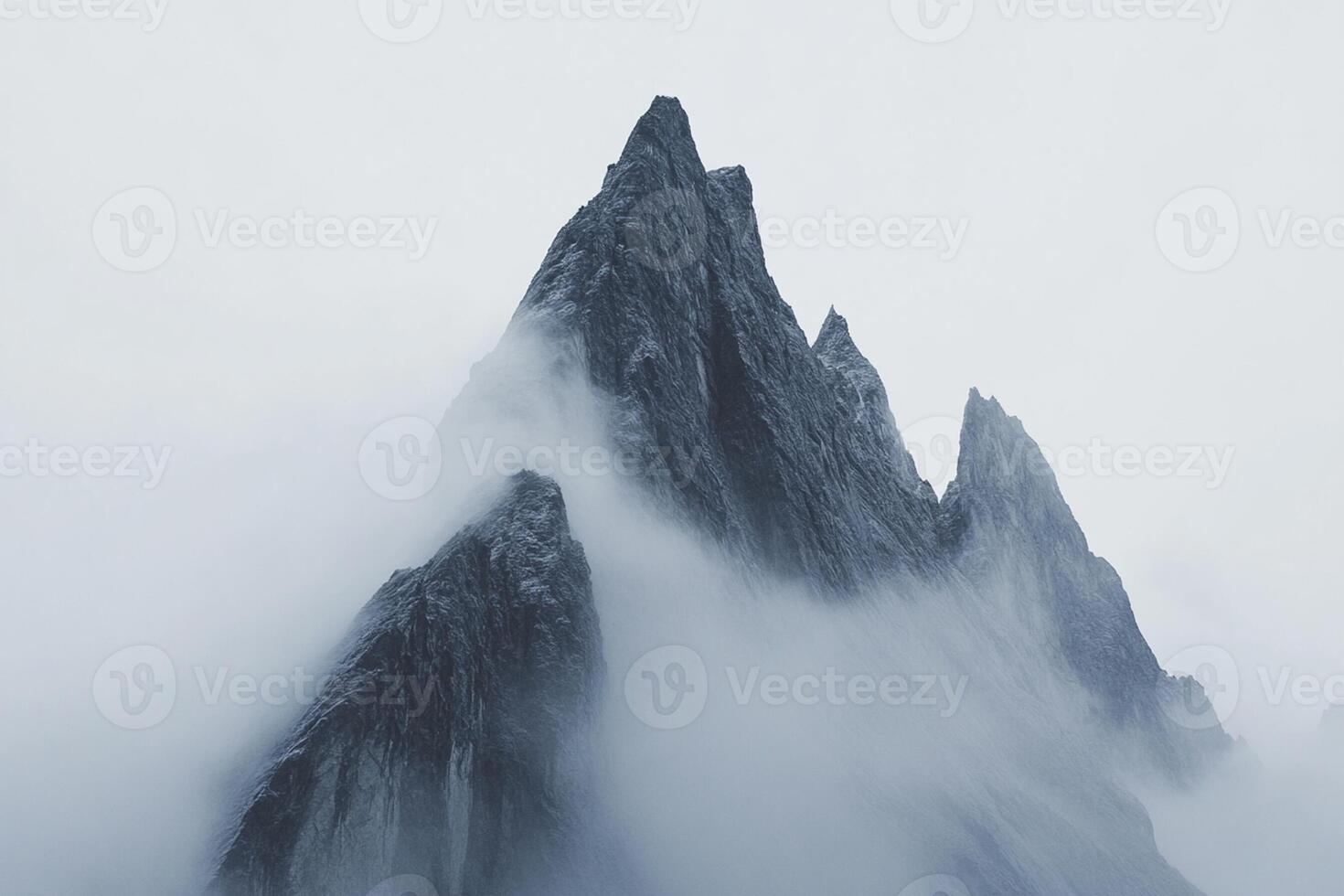 A mountain is covered in fog and snow photo