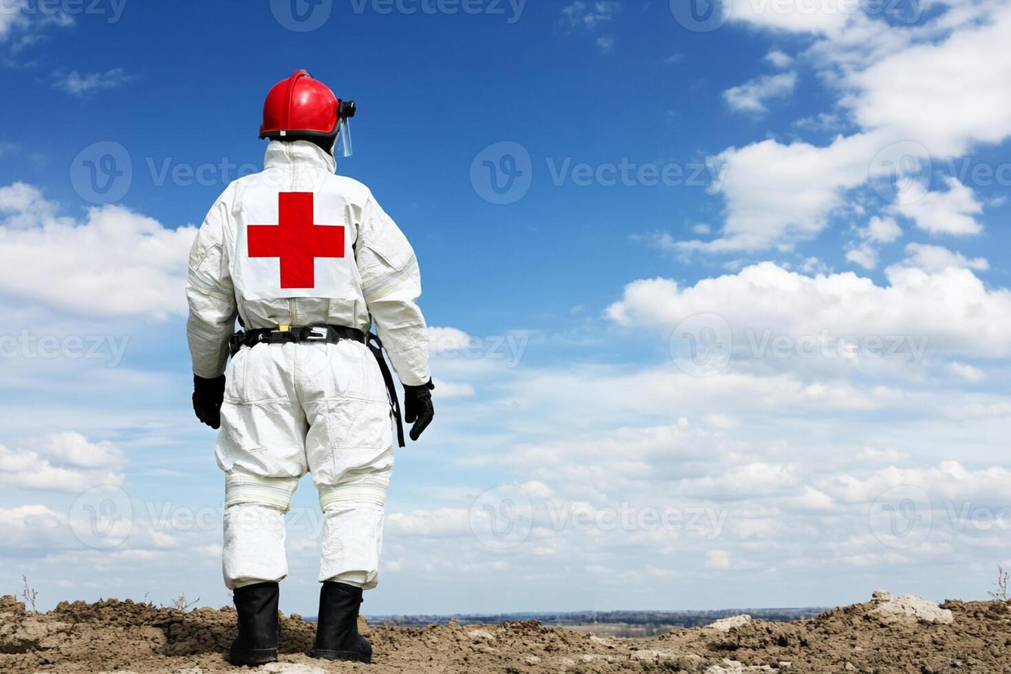 A man in a white suit and red cross on his back photo