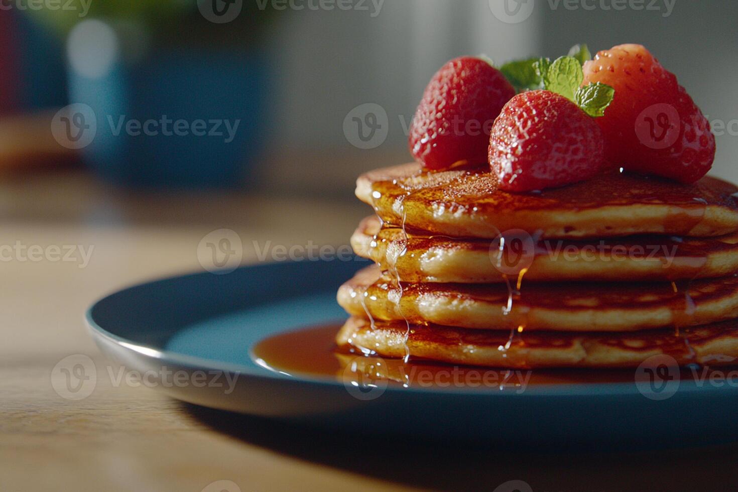 A stack of pancakes with strawberries on top photo