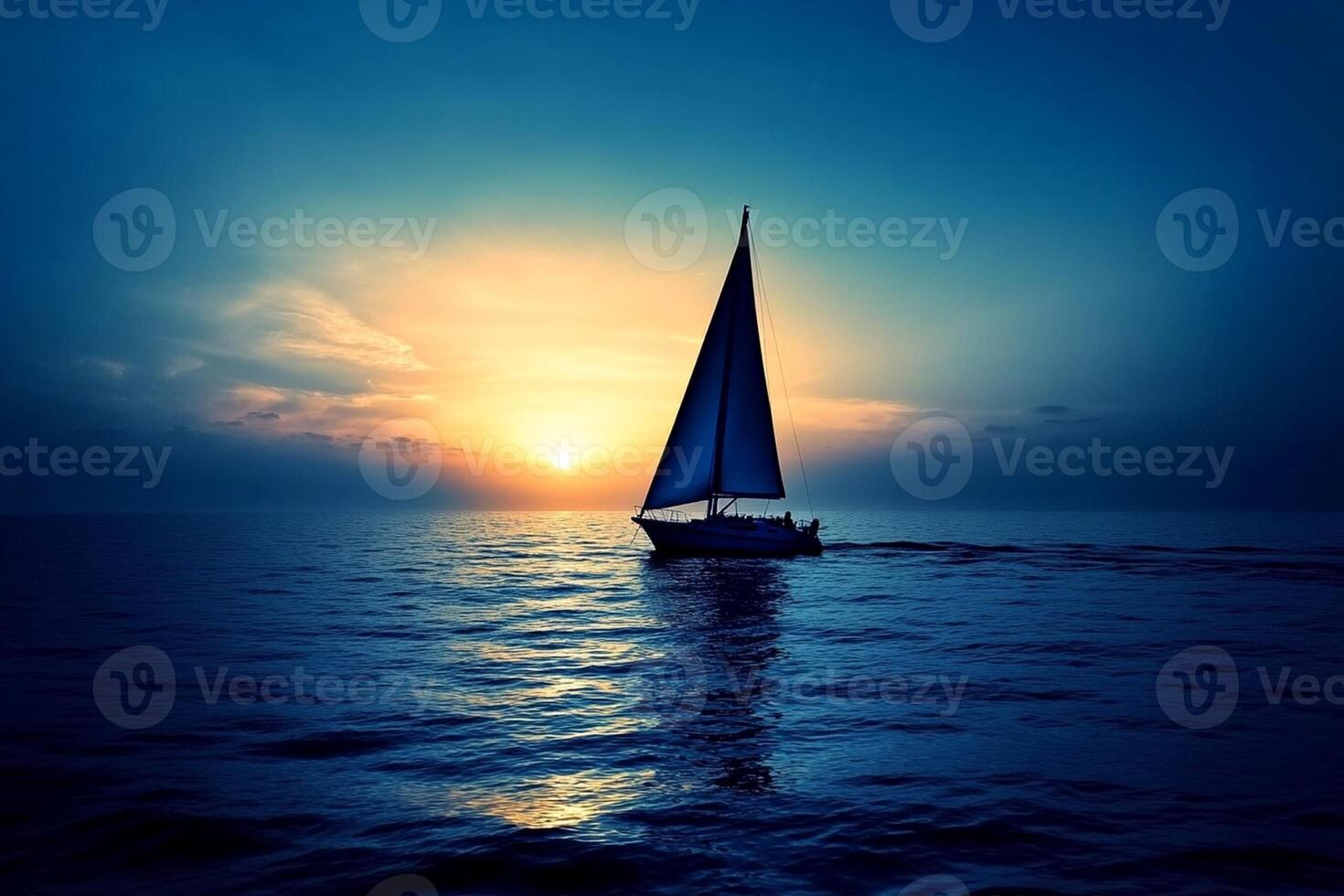 A sailboat is sailing in the ocean at sunset photo