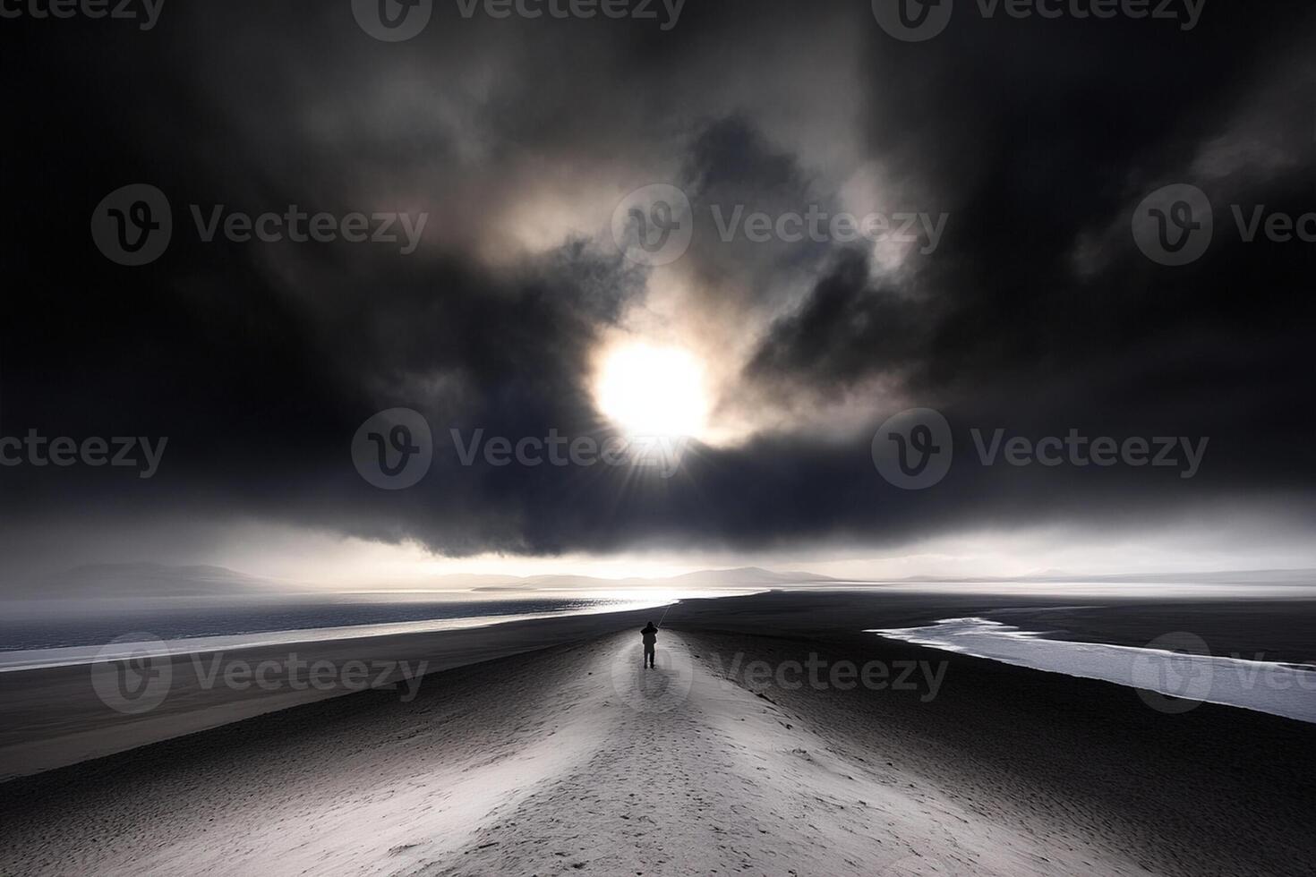A lone person walking on a dark road under a cloudy sky photo