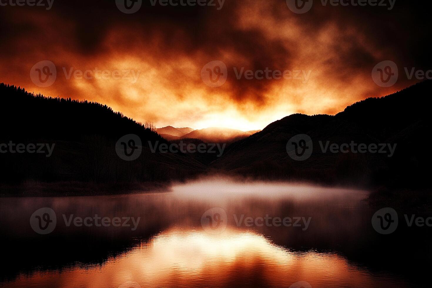 A lake with fog and mountains in the background photo