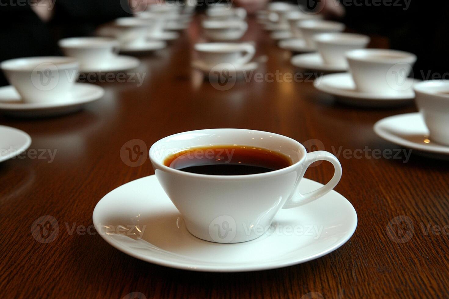 A table with many cups of coffee and saucers photo