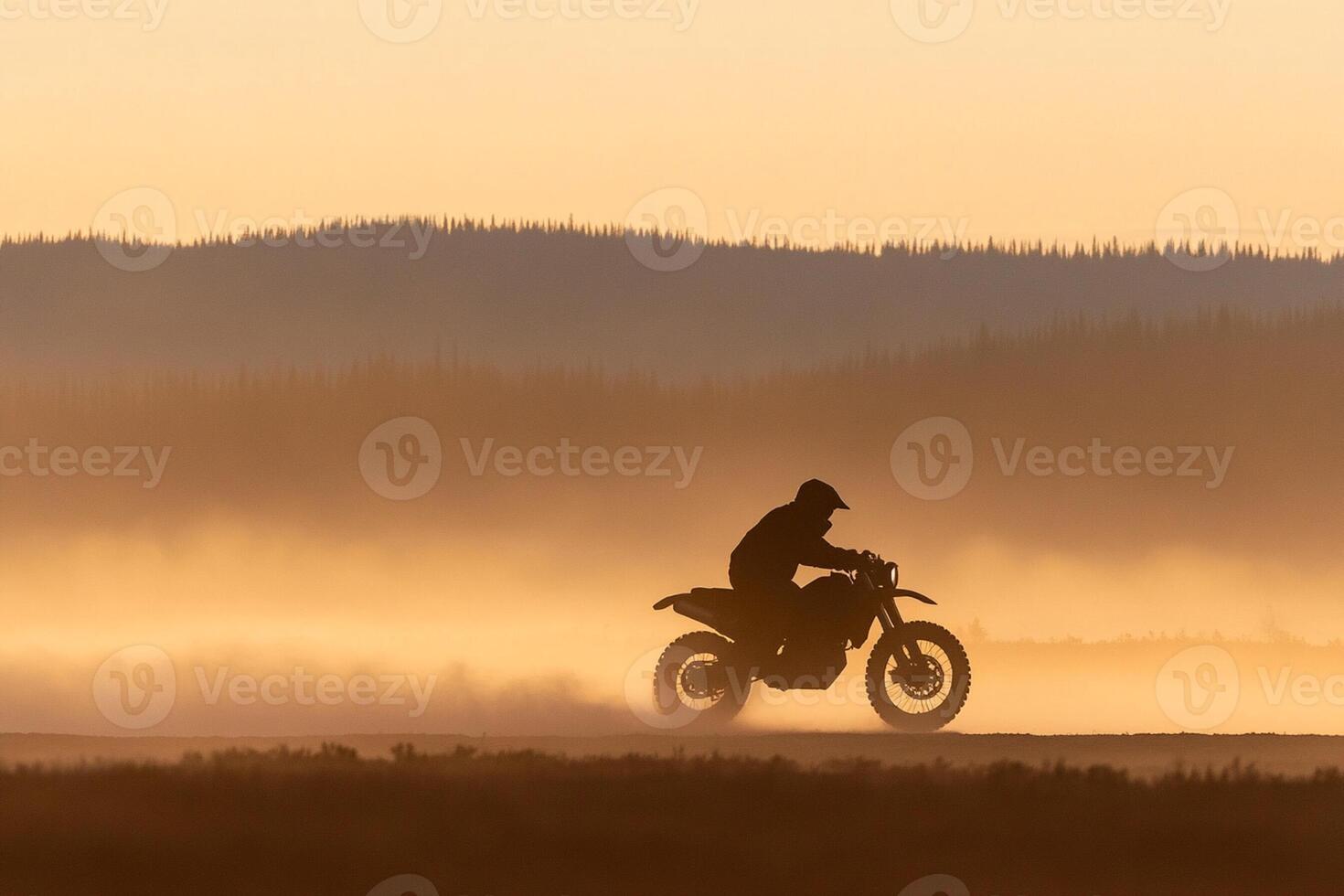 A person riding a motorcycle on a foggy road photo