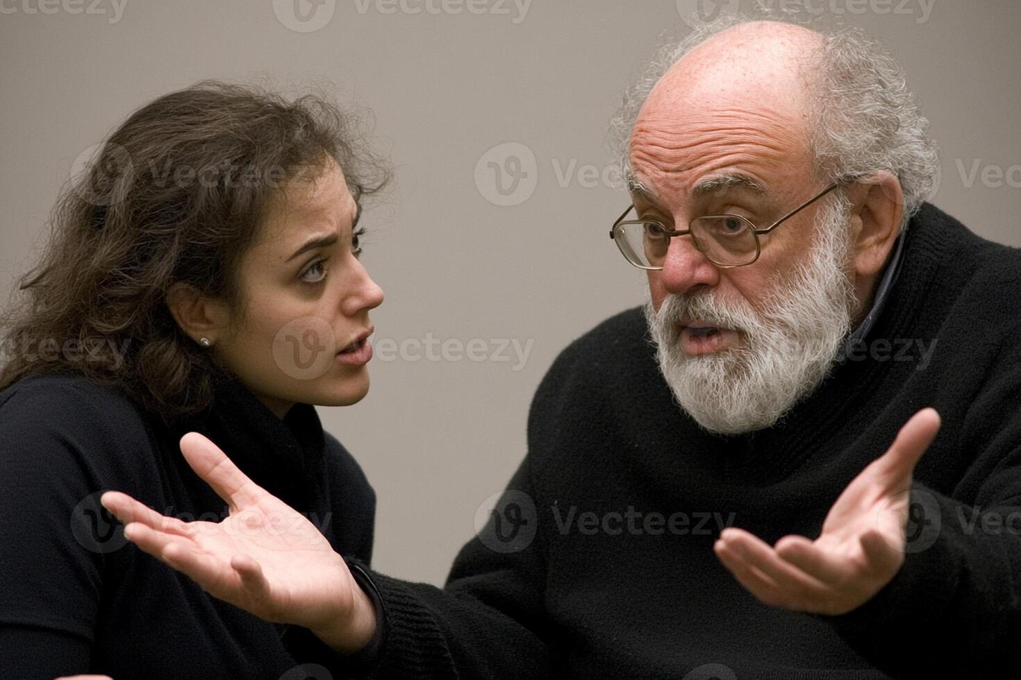 An older man and a young woman sitting together photo
