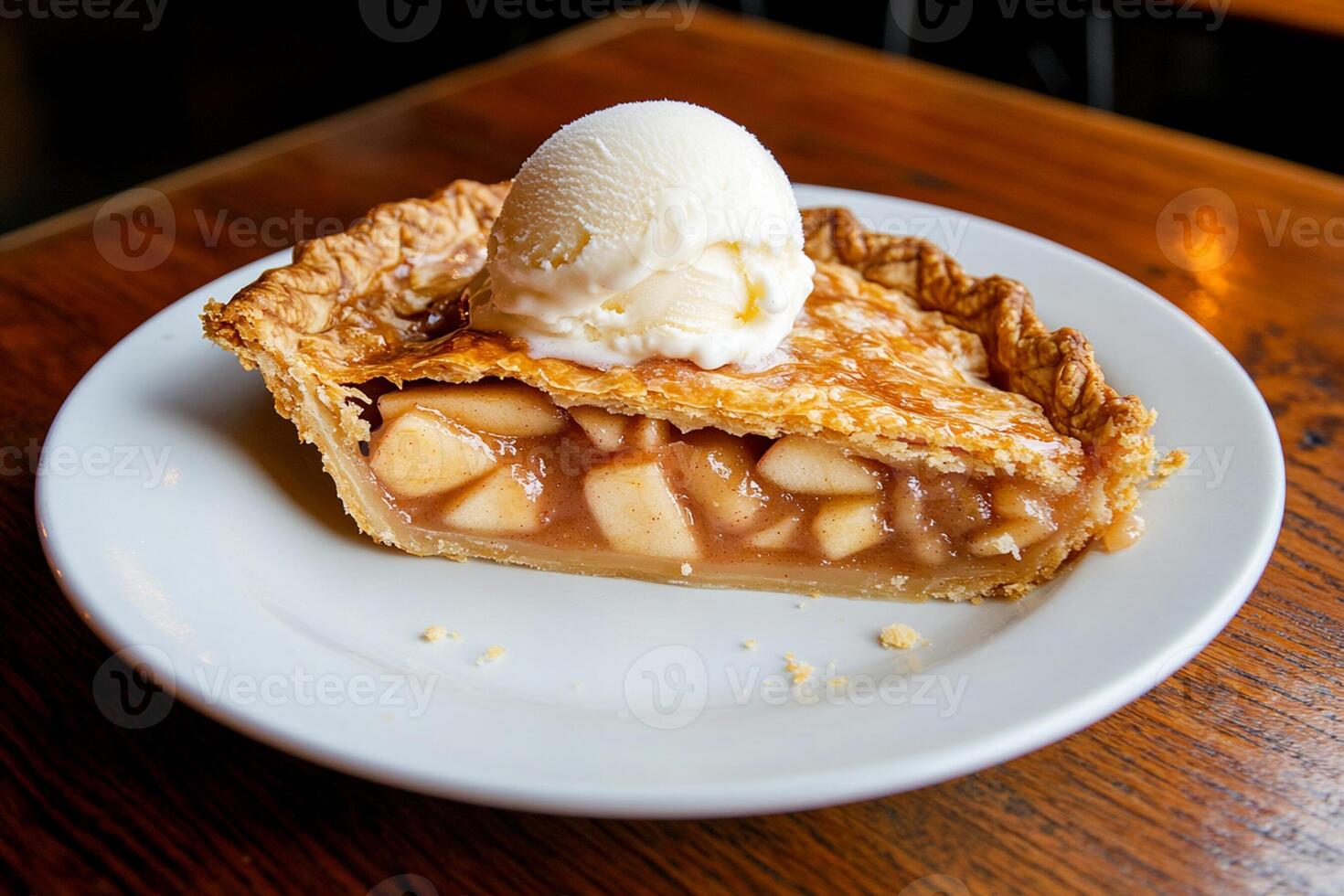 A slice of pie on a plate with ice cream photo