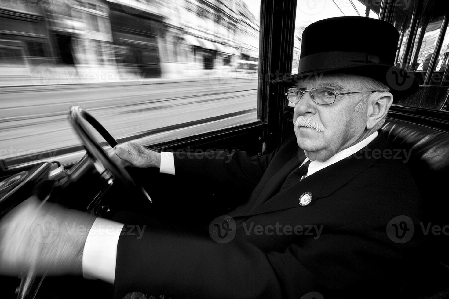 An old man driving a car with a blurry image photo