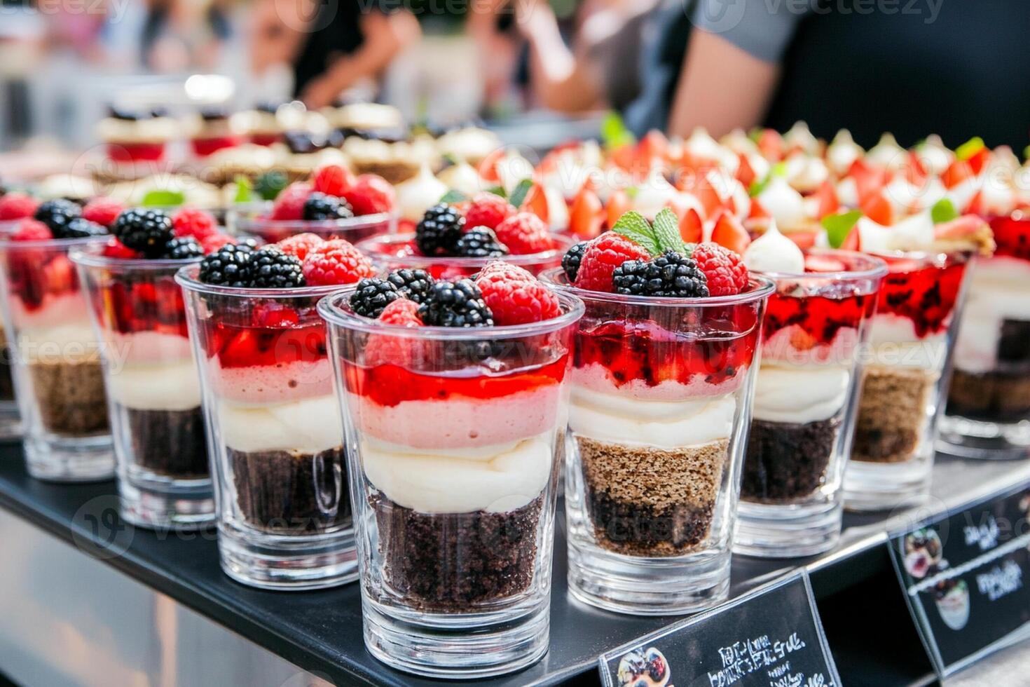 Several dessert trays with fruit and berries photo