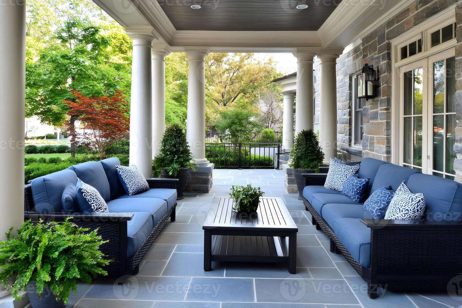 Elegant patio with blue sofas inviting relaxation in a luxurious home photo
