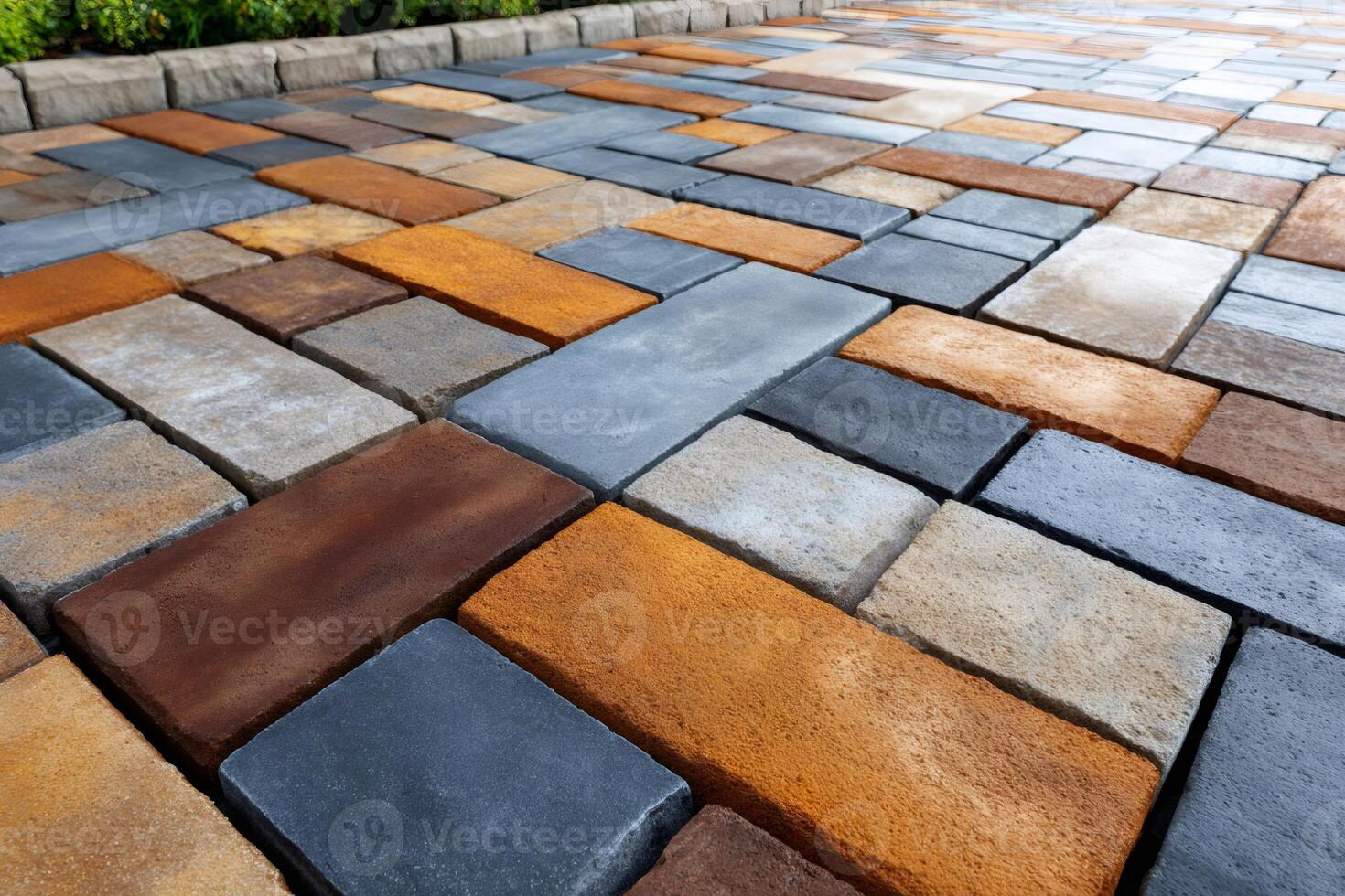Multicolored cobblestone pavement creating beautiful geometric patterns photo