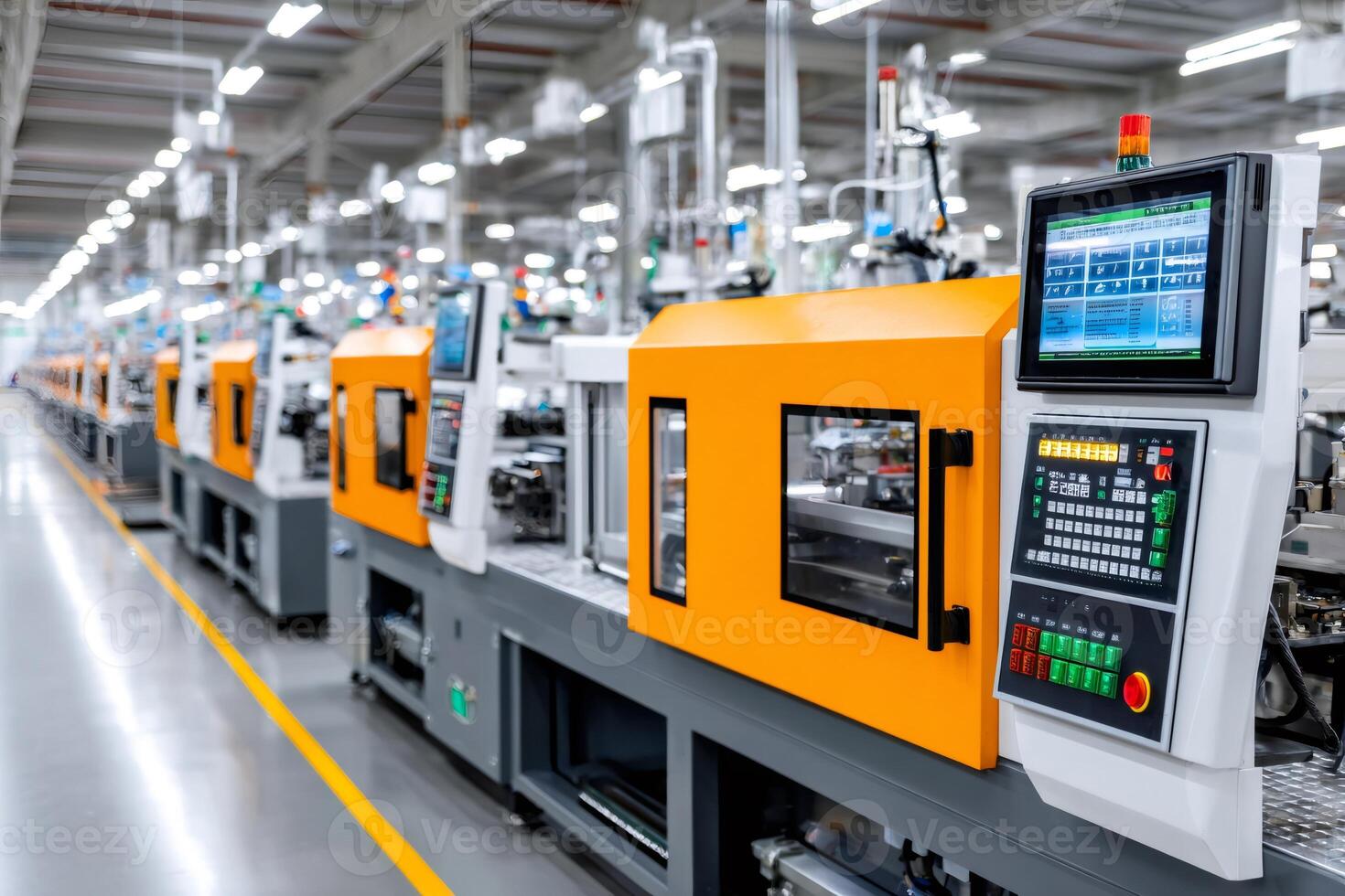 Modern plastic injection molding machines operating in a factory photo