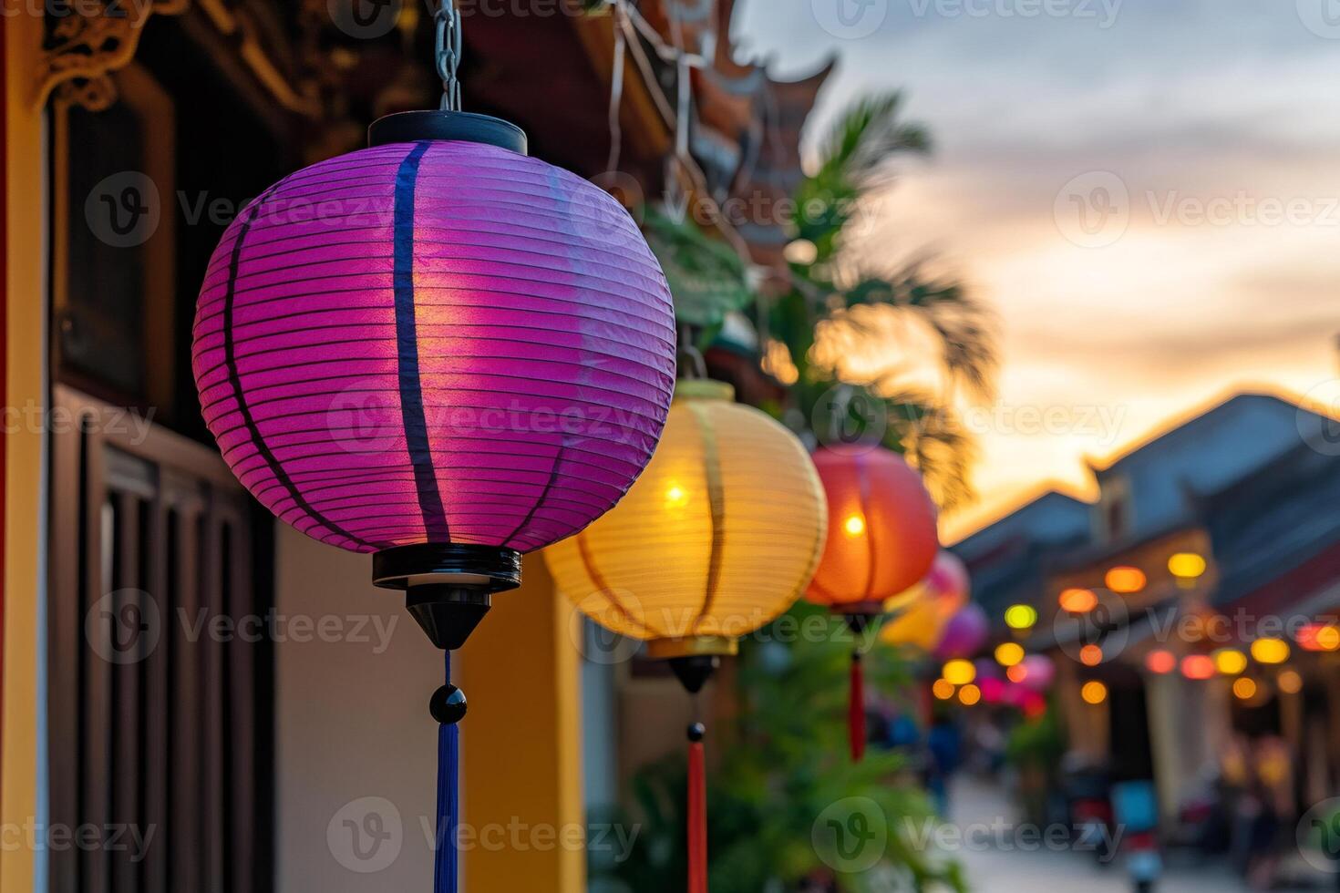 Colorful paper lanterns illuminating hoi an ancient town at sunset photo
