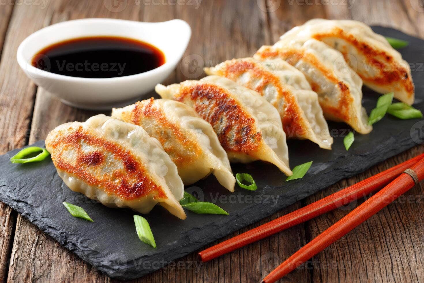 Crispy fried dumplings gyoza pot stickers with soy sauce and chopsticks.. photo