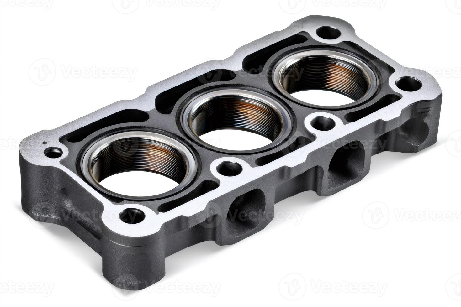 Section of a metal engine block showing threaded cylinder sleeves photo