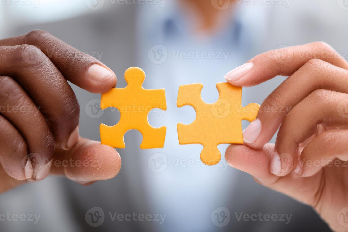 Businesspeople joining two puzzle pieces, teamwork and collaboration concept photo