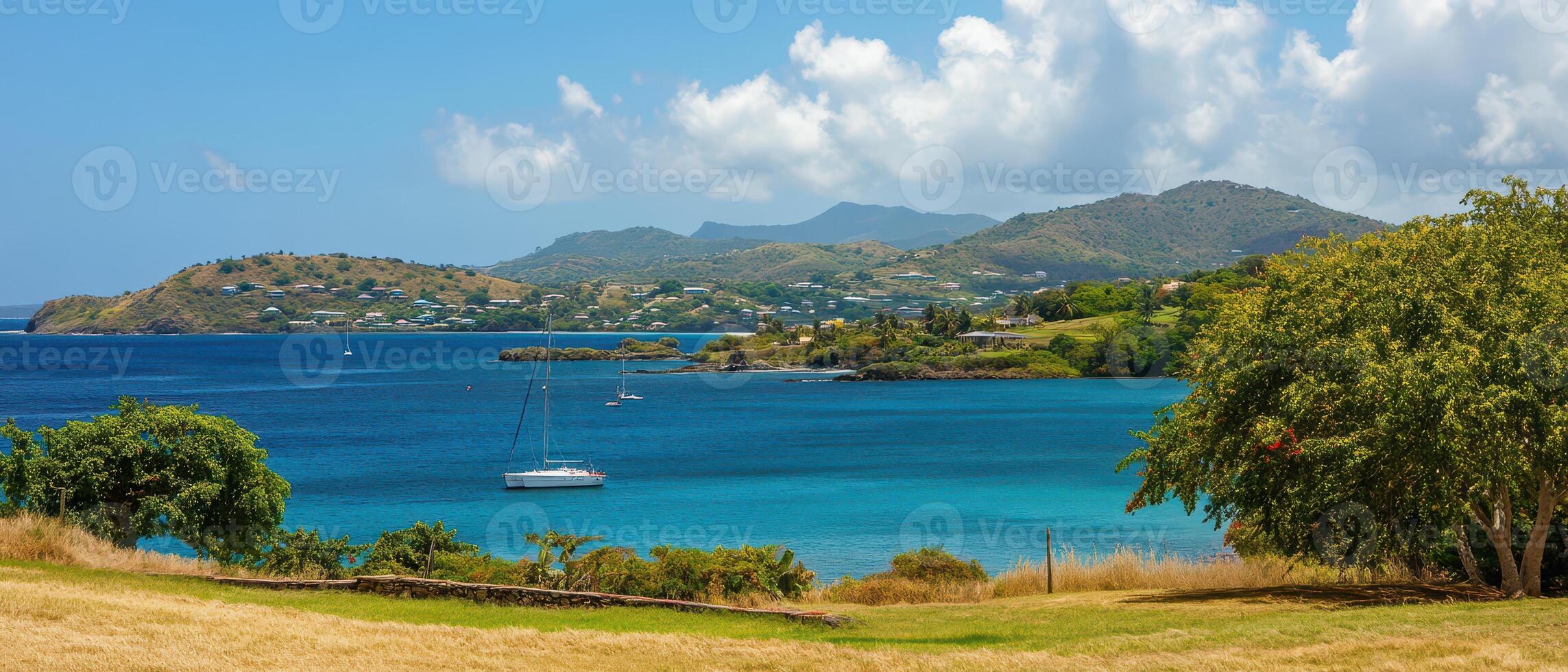 Beautiful coastal view with sailboat on calm water photo