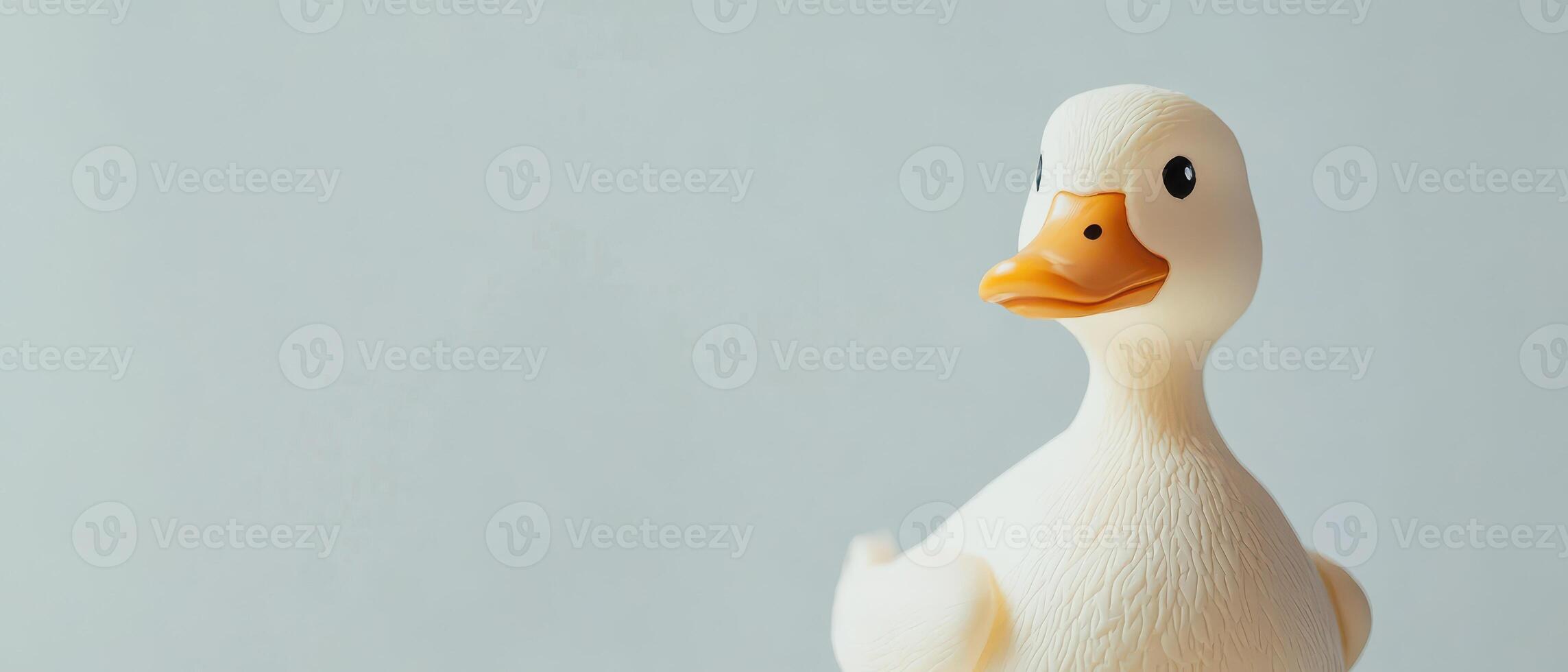 Cheerful rubber duck on a light background photo