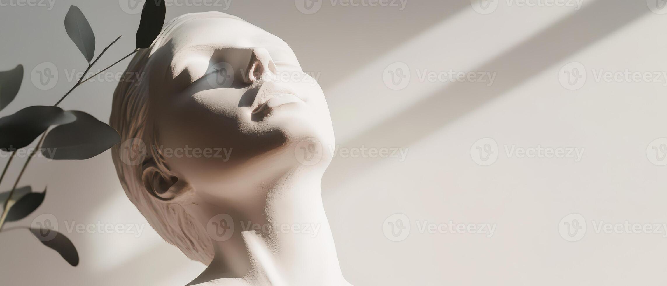 Serene figure sculpture in natural light photo