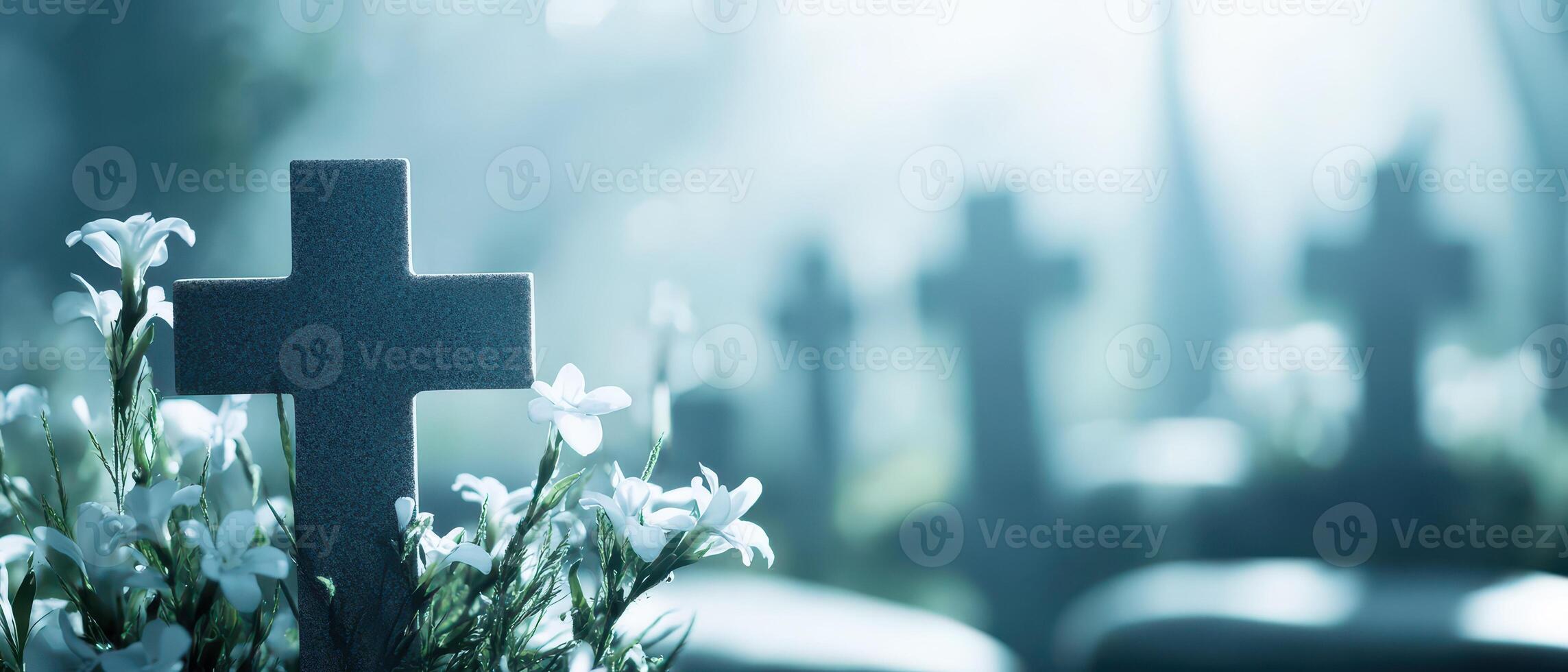 Graveyard with flowers and crosses at dusk photo