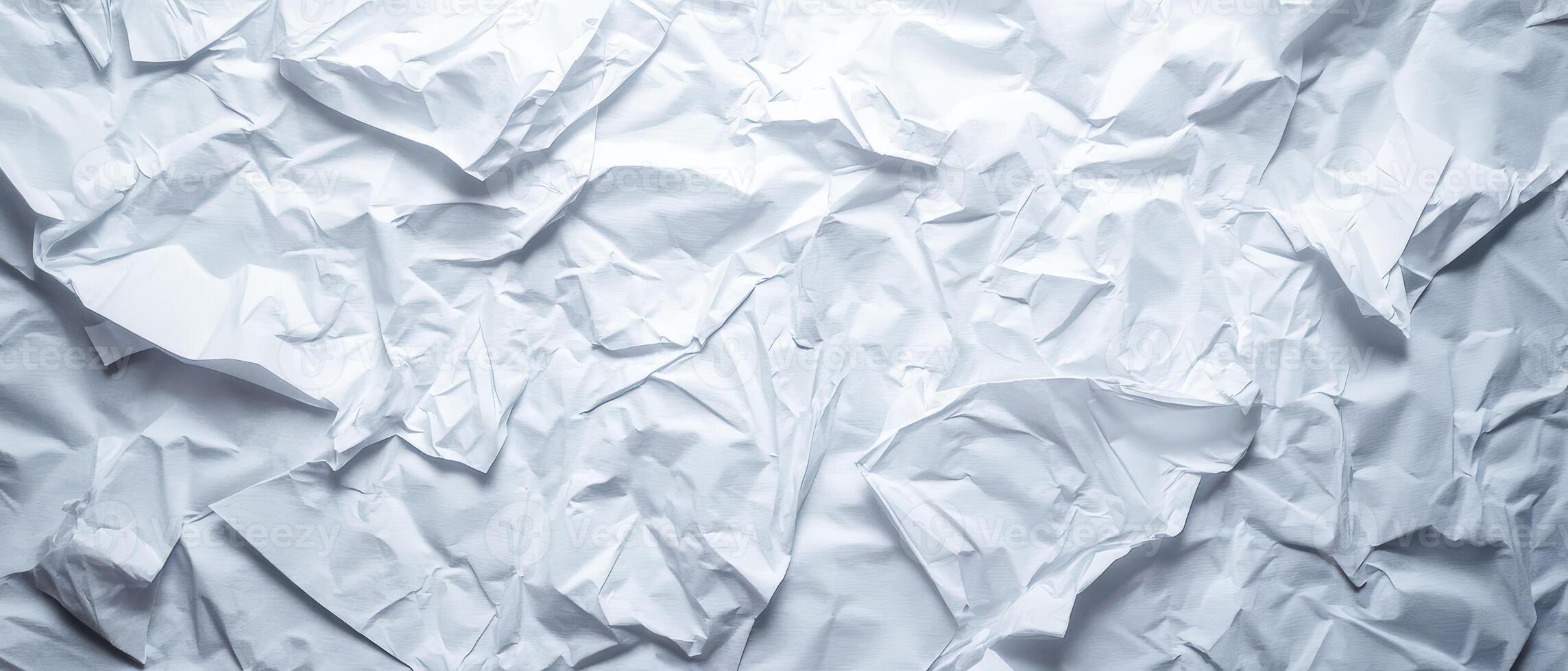 Crumpled white paper texture with varied folds photo