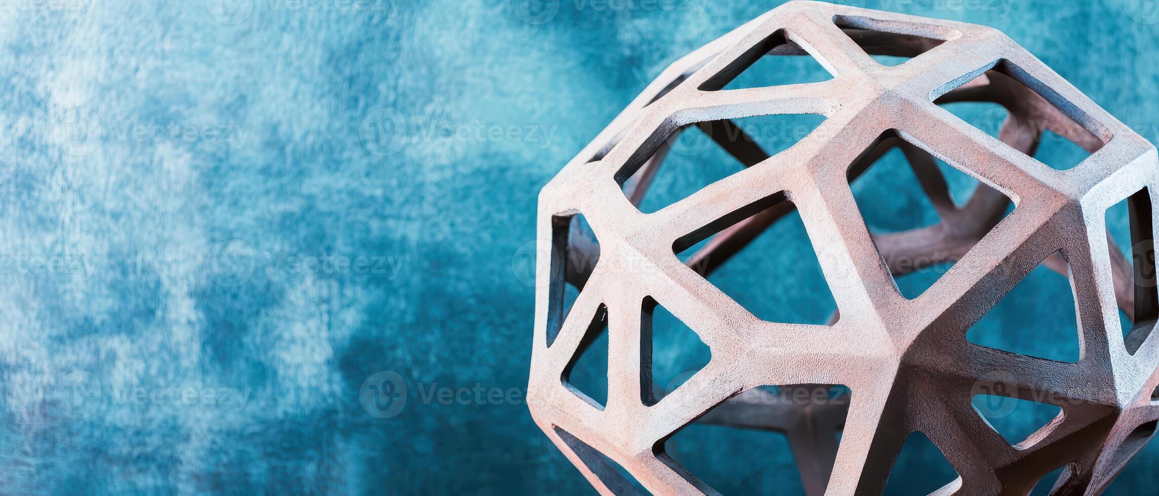 Modern geometric sculpture on textured background photo