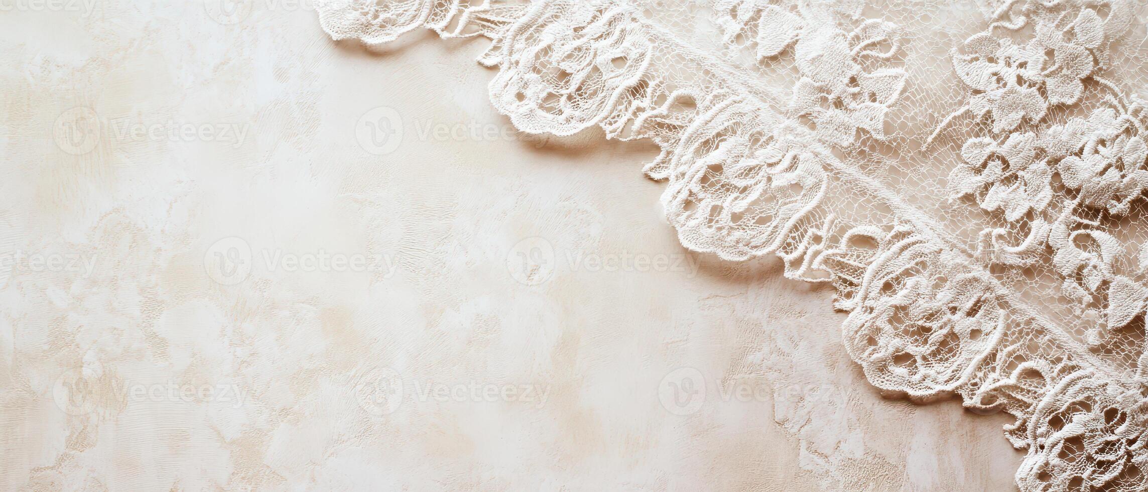 Delicate lace border on a soft textured surface photo