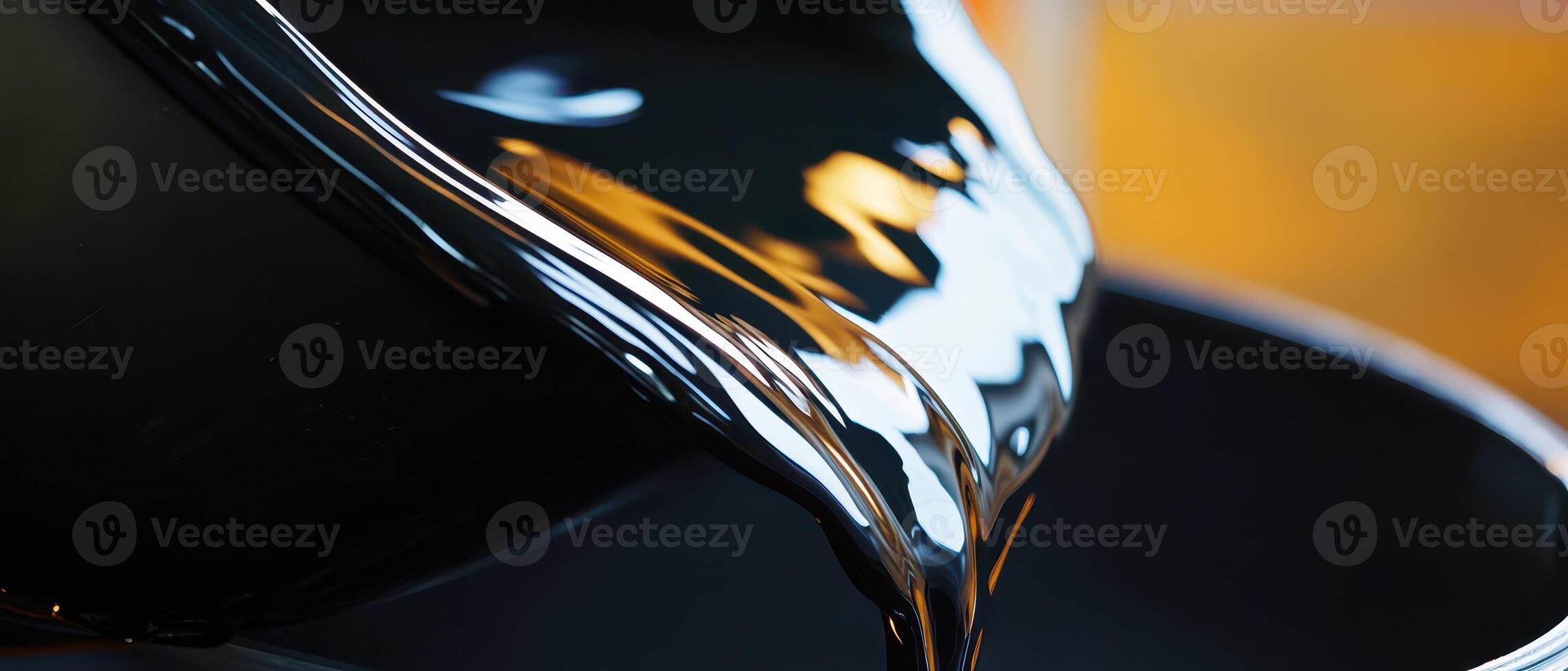 Pouring liquid material into a black container photo