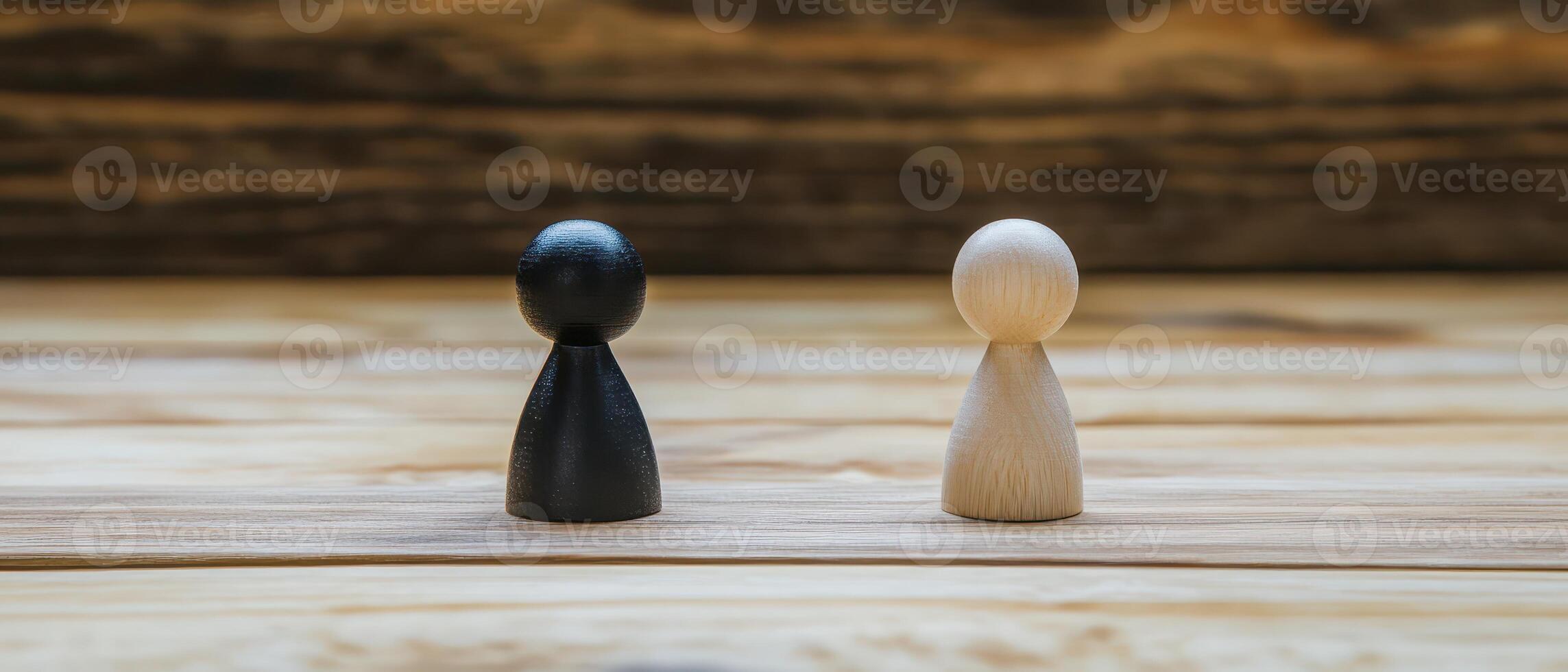 Two colorful figurines on wood photo