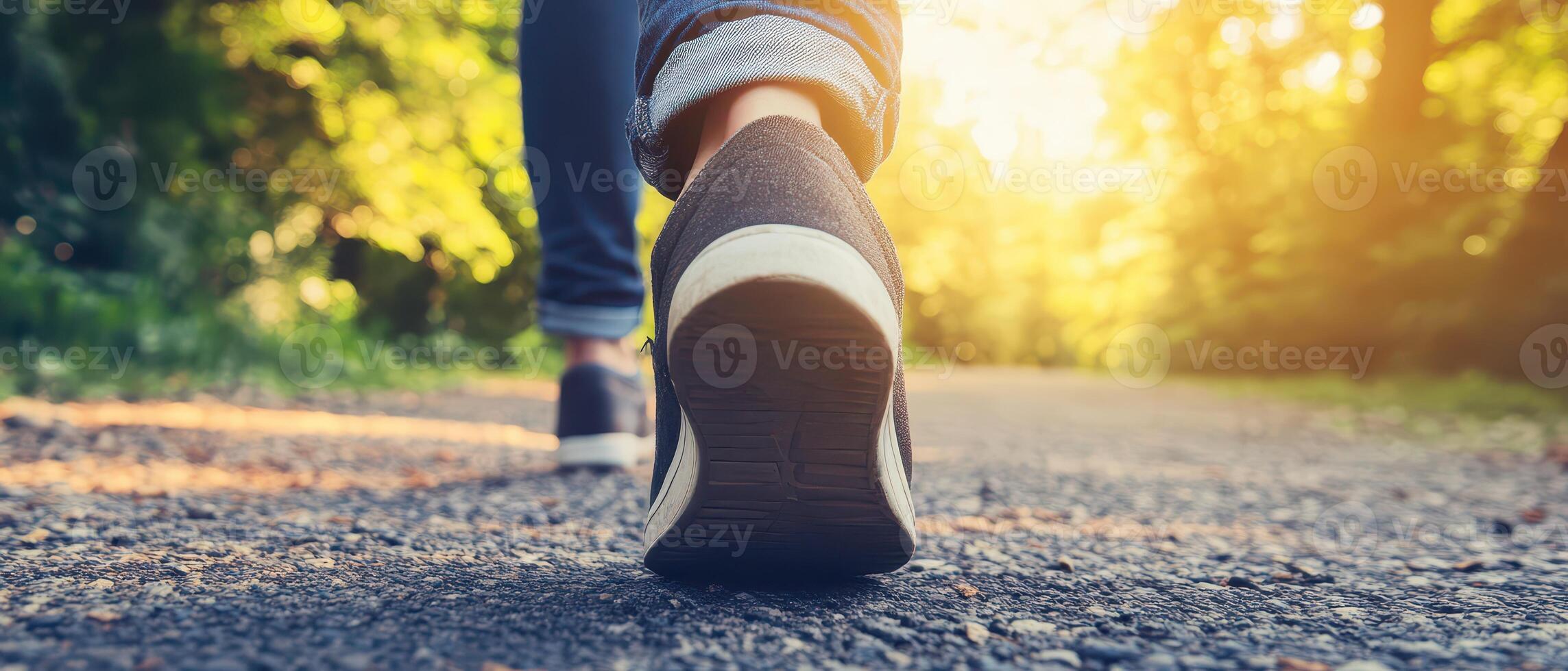 Walking along a sunlit path in nature photo