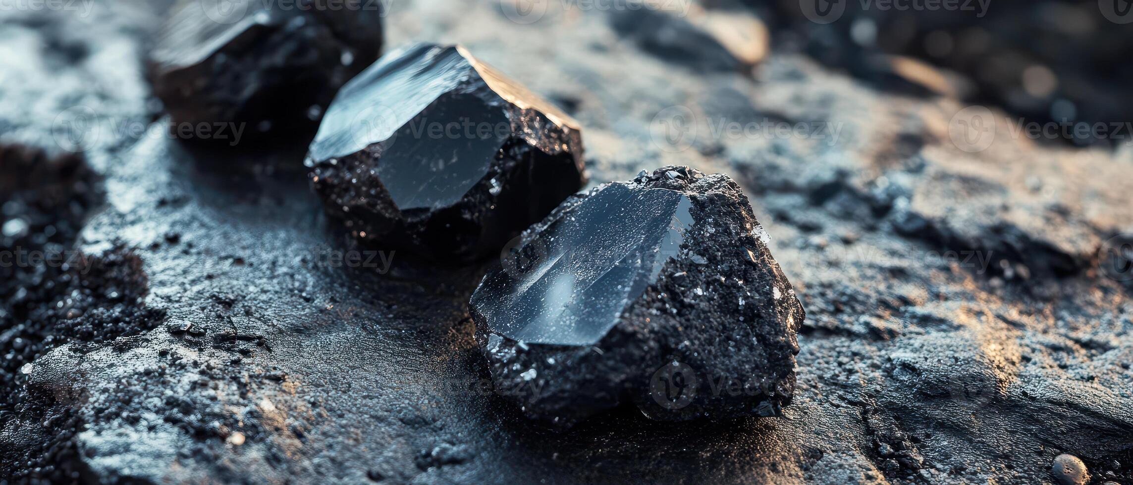 Black obsidian on rocky surface photo