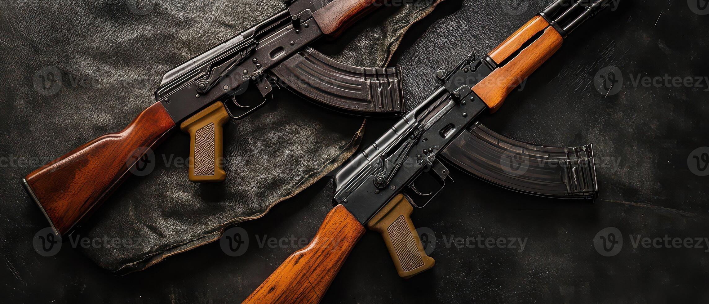 Rifles on dark surface with fabric backdrop photo