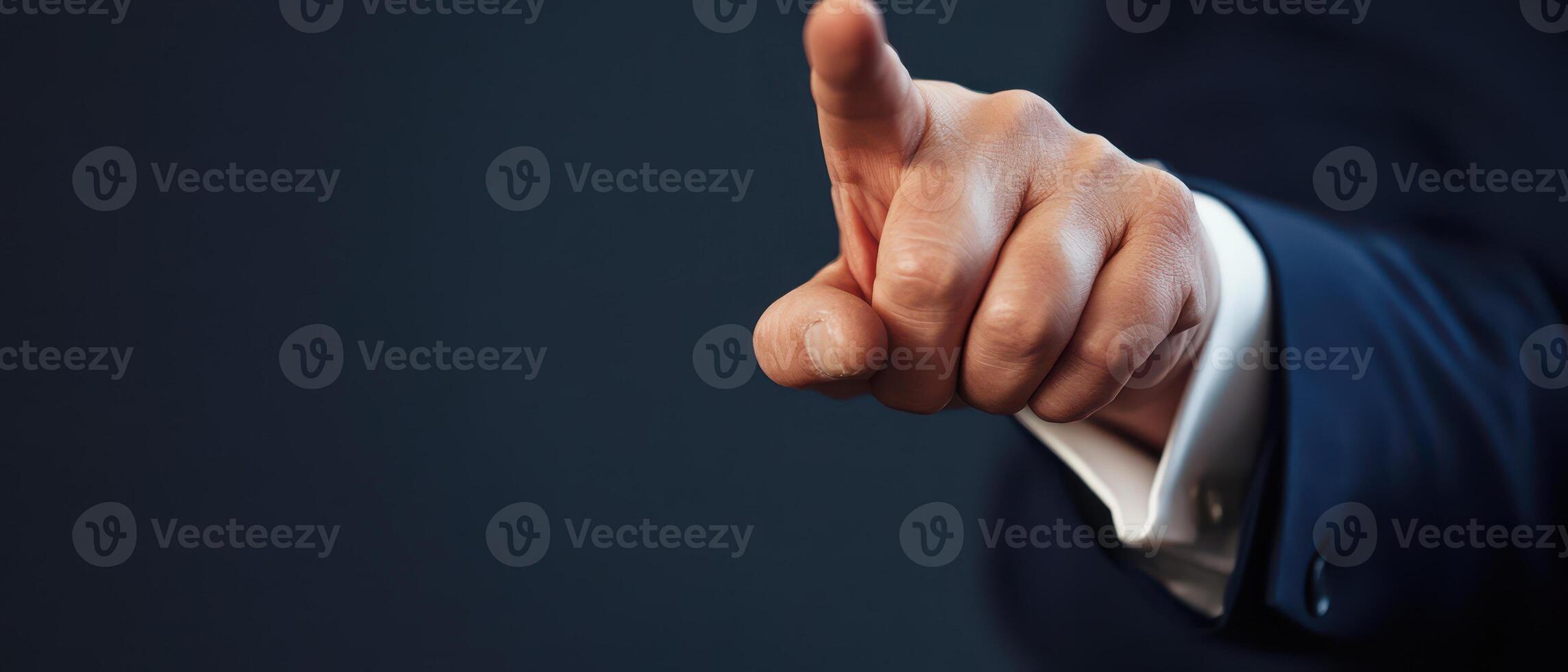 Hand pointing firmly during a discussion photo